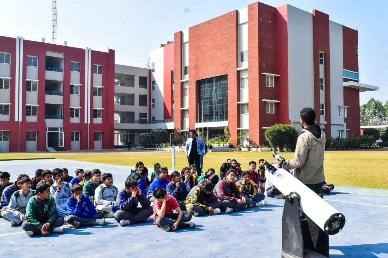 Students learning with telescopes